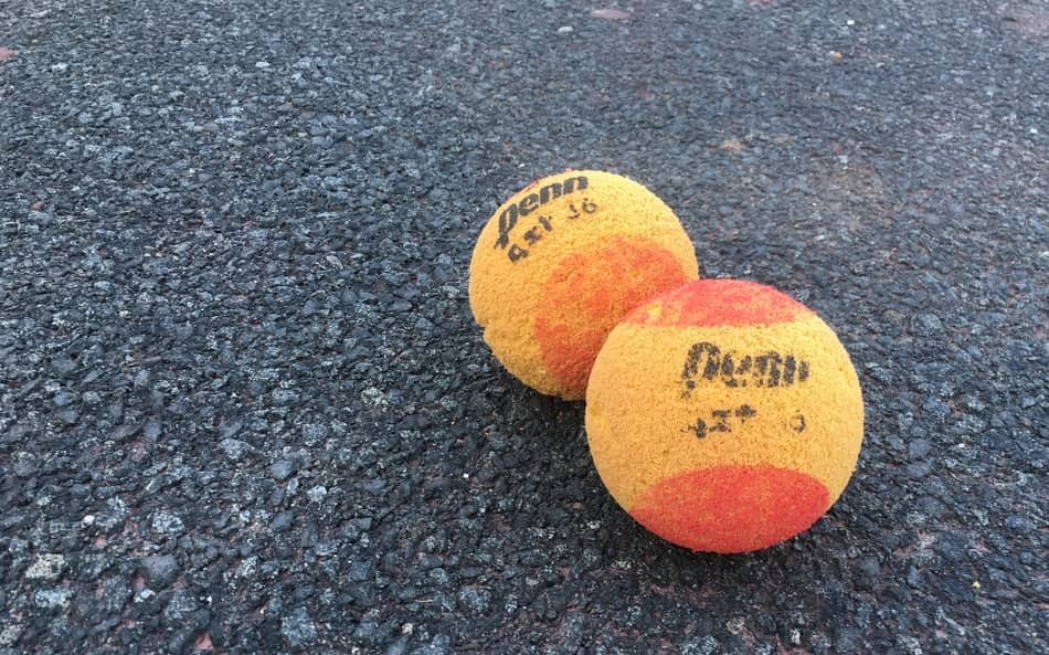 two tennis foam balls