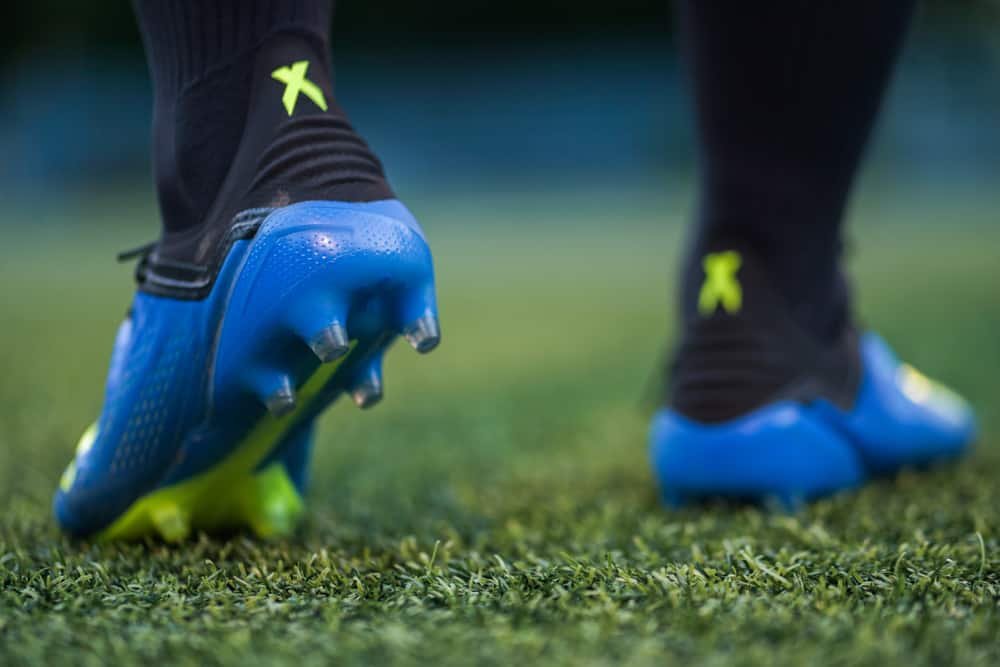 A Football player in training with Adidas X 18