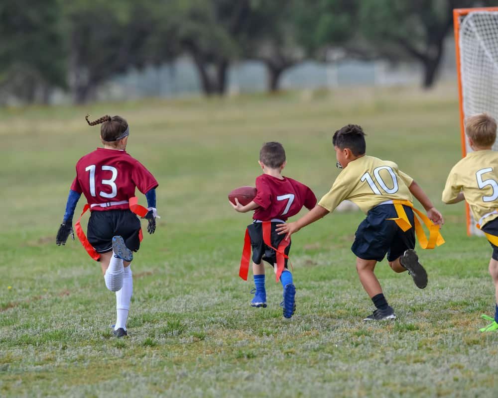 Children playing a Flag Football game outside 1