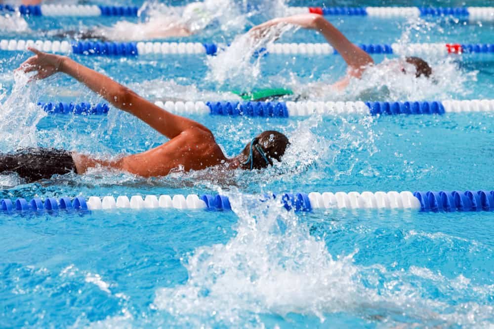 Motion blurred swimmers in a freestyle race